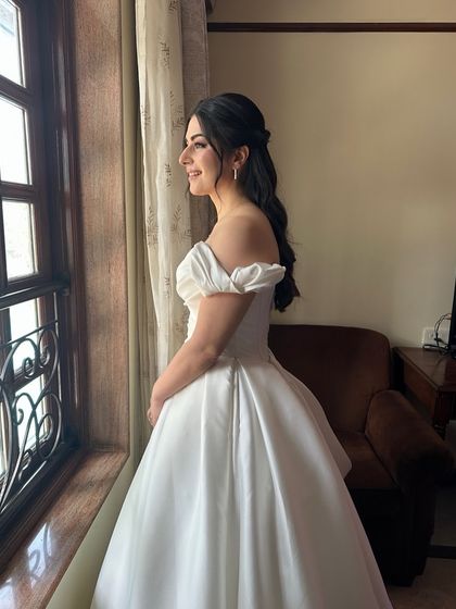 A full view of Ozlem's classic ballgown. Her simple, elegant hair and makeup allow the stunning dress to be the main focus.