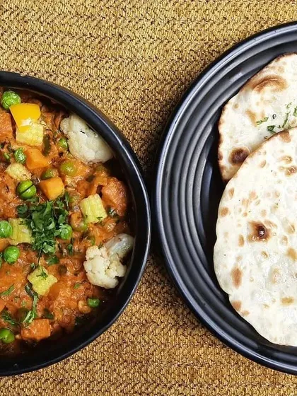 Our Subz Dum Matka is a vibrant mix of seasonal vegetables slow-cooked in a sealed pot to retain all the flavors and aromas. Paired with fresh kulcha, it's a complete meal.