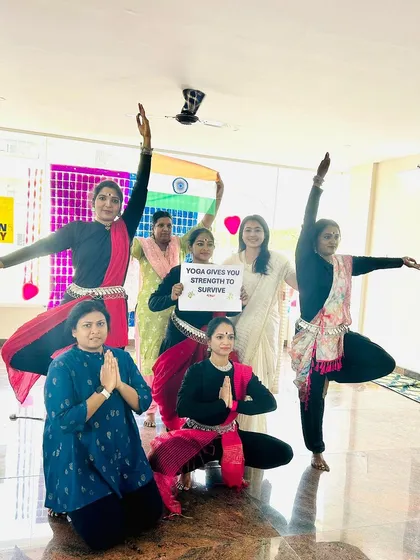 A powerful pose from the Women's Day performance, combining yogic strength with patriotic spirit.