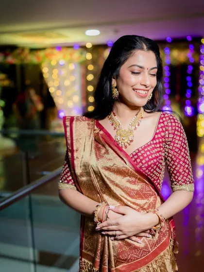 A beautiful, happy shot from a pre-wedding event. Her makeup is radiant and her smile is infectious, creating a perfect memory of the celebration.