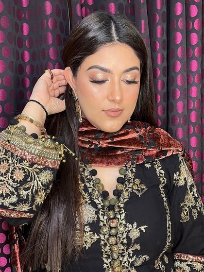 A close-up of the eye makeup. A soft brown smokey eye is a versatile choice that adds glamour to any look.