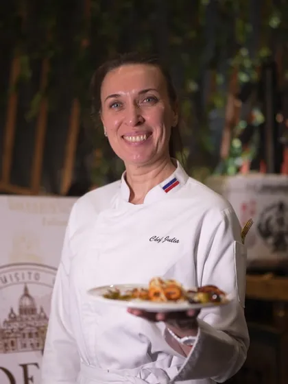 Chef Julia, one of our international culinary experts, proudly presents a plate of her authentic Italian creation.