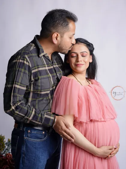 It's the small, in-between moments that often hold the most love. A gentle kiss on the forehead is a simple, beautiful expression of partnership and excitement for the journey ahead.