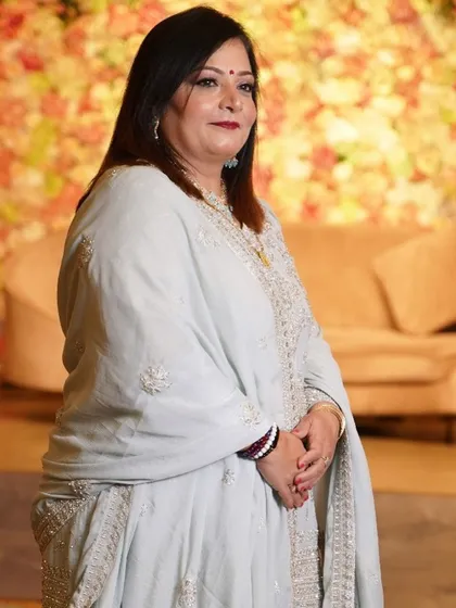 A full-length shot of the mother looking elegant and ready for the party.