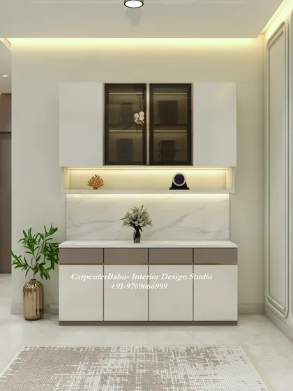 A beautiful crockery unit with a marble-finish countertop and backlit glass cabinets. It's a perfect example of functional furniture that is also a decorative piece.