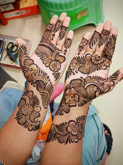 Another angle of the floral bangle design, showing how it elegantly decorates the hand and wrist.