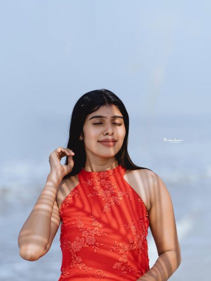 I love playing with natural light and shadows, like the palm leaf shadow in this beach portrait. It adds a creative and graphic element to an otherwise simple shot.