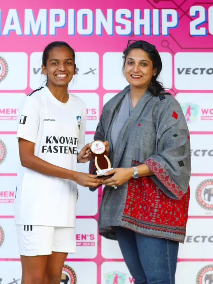 Our player Shruti receiving the Player of the Match award from a dignitary after her stellar performance against Warriors FC in the Women's Championship.