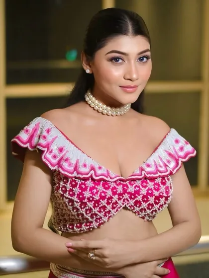 Another angle of this glamorous look, showing the intricate beadwork on the blouse. The makeup is kept glowy and fresh to balance the details.