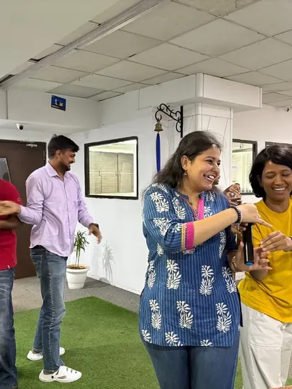 Yoga is a powerful tool for team bonding. In this moment of shared laughter and lightheartedness during a session, you can see how practicing together helps build connection and a positive, supportive atmosphere within the team.
