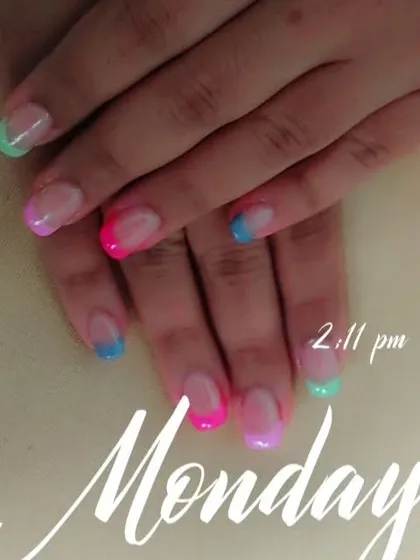 A playful and modern twist on the French manicure, with each nail tip painted in a different bright, neon color. This is a great way to add a pop of fun to your look.
