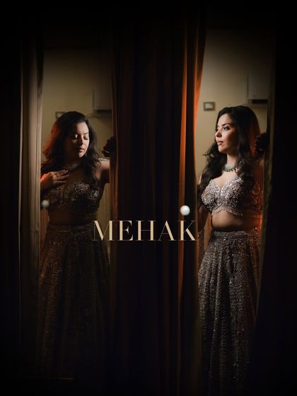 An artistic portrait of the bride, Mehak, using reflections. This moody and creative shot from her sangeet adds a touch of mystery and elegance.