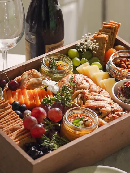 A beautifully arranged Cheese & Dip Grazing Box, perfect for a Rakhi celebration or any intimate gathering. It's a complete party in a box, designed to impress your guests.