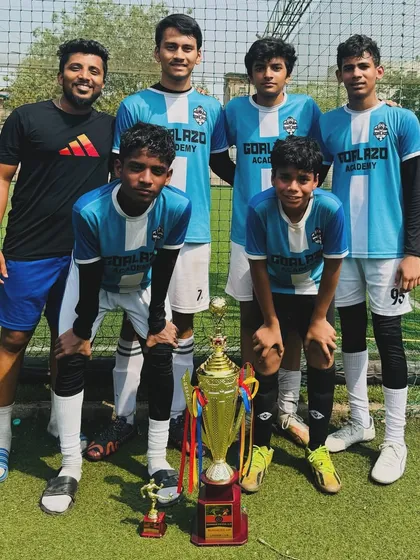 Another trophy for the collection. Our players and coach posing after a successful tournament run.