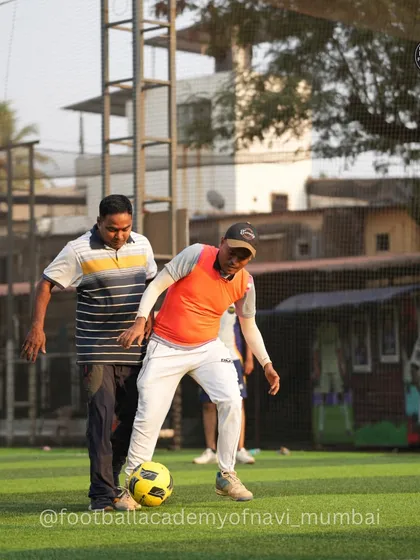 A moment of friendly competition between two dads during a parent match. Our sessions encourage everyone to get involved, stay active, and enjoy the game.