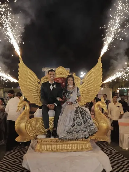 For a truly unique reception entry, we arranged this magnificent golden peacock-winged throne. Paired with cold pyro effects, it creates a royal and dramatic seating moment for the couple that stands out.