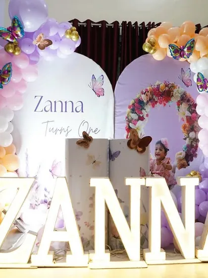Another angle of Zanna's party, showing the light-up number '1' and the delicate butterfly details scattered throughout the balloon arrangements.