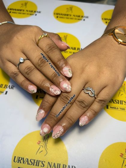 Soft and elegant, this set features delicate white flowers painted over a blush pink base. I added silver accents and a touch of glitter to create a dreamy, romantic look.