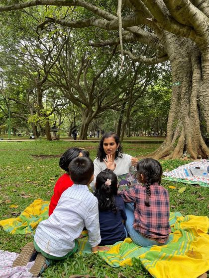 Ayushi engages a group of children, using hand gestures to tell the story. This interactive approach is fundamental to our workshops, encouraging participation and making learning fun.