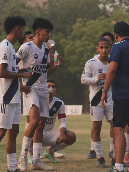 A quick hydration break and tactical discussion during a training session. Even our breaks are focused on strategy and improvement.