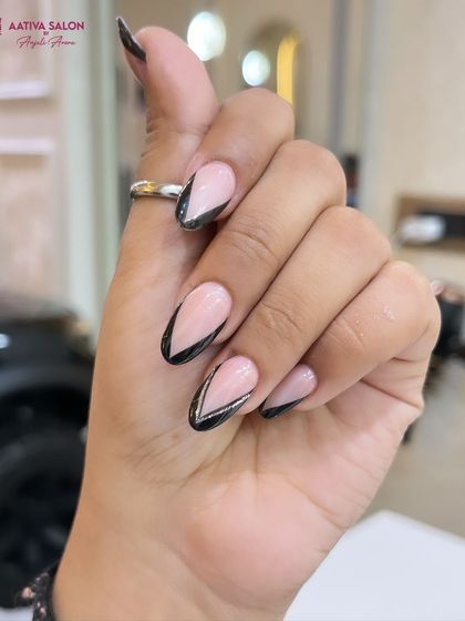 A close-up of our graphic black V-tip French manicure. This edgy design is perfect for those who want something different from the classic look.