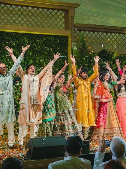 A real-life "Hum Sath Sath Hai" moment. This grand finale brought the entire extended family on stage for a joyous celebration, complete with a confetti shower.