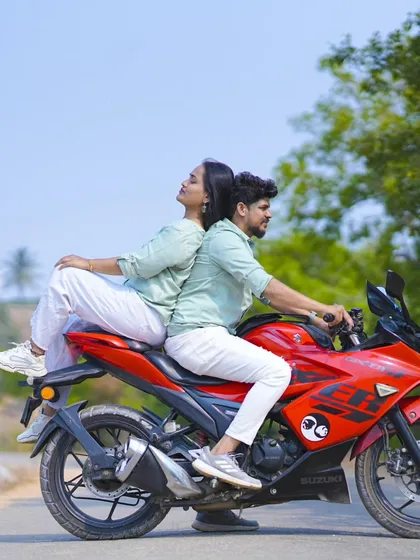 A creative and fun pose on a red motorcycle. We love capturing the unique personality of each couple.