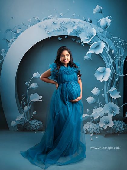 A modern and artistic take with a large, graphic floral arch. The monochromatic blue theme creates a cool, serene, and stylish portrait.