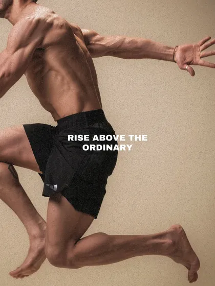 An artistic shot of an athlete in mid-air, capturing the power and grace of movement. We help you rise above the ordinary.
