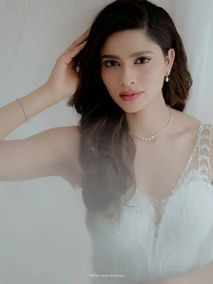 A soft and dreamy portrait of the Christian bride, the light creating a gentle, ethereal glow around her.