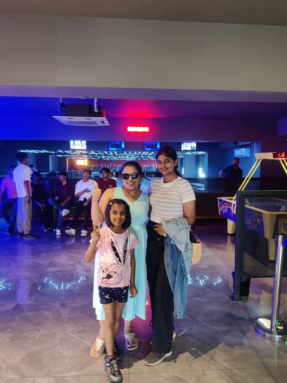 A family celebrating a birthday with us. Our gaming zone is a great place for all ages to come together and have a memorable time.