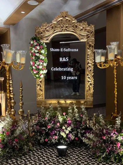 Marking a decade of love calls for pure romance. For this 10th-anniversary celebration, we used an ornate, oversized gold mirror as the centerpiece, surrounded by lush florals and candelabras to create a "Sham-E-Sufiyana" ambiance.
