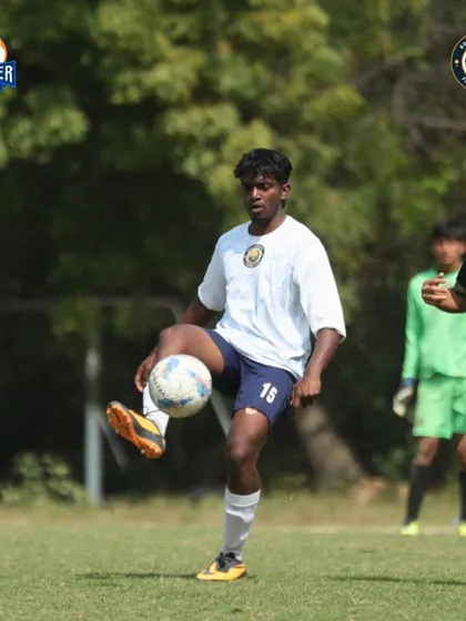 A player skillfully controlling the ball on their chest, demonstrating excellent technique and readiness to make the next move.