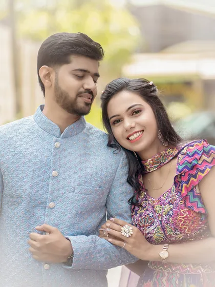 A sweet and gentle moment between the couple. She rests her head on his arm, and her happy smile is a perfect reflection of the love and comfort she feels with him.
