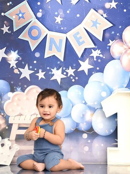 A quiet moment amidst the birthday balloons. This first birthday shoot captures the wonder of being one year old.