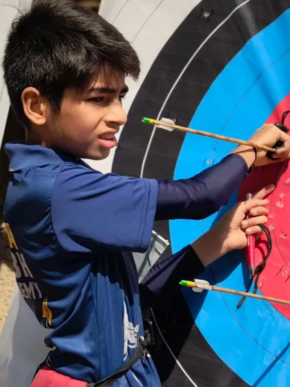 Checking the scores. Every arrow counts, and we teach our students the importance of every single shot.