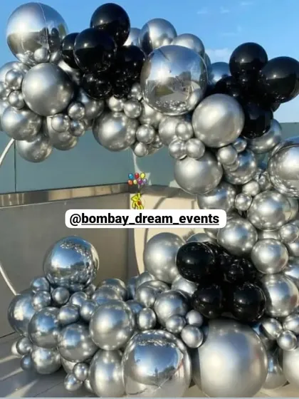 A premium chrome balloon arch on a circular frame, creating a sleek and modern photo backdrop for any high-end event.