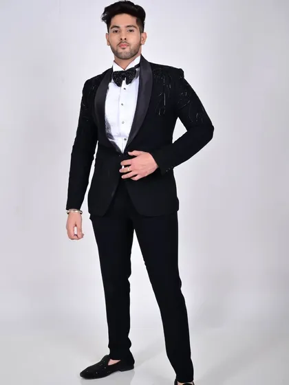 A full-length view of the model in our black tuxedo, demonstrating its classic elegance and modern appeal.