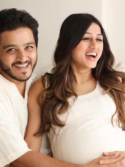 The pure joy and laughter between a couple is what makes a session so special. This candid moment captures their excitement and love in our bright, airy studio setting.