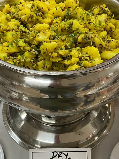 A simple and delicious dry potato sabzi served as part of a fulfilling meal.
