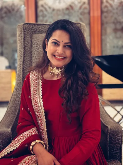 A close-up portrait of Priyanka Barve, looking radiant and festive.
