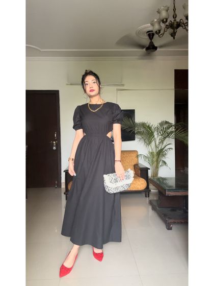 The side cut-outs on this dress are perfectly placed to create a flattering silhouette. It’s all in the details.