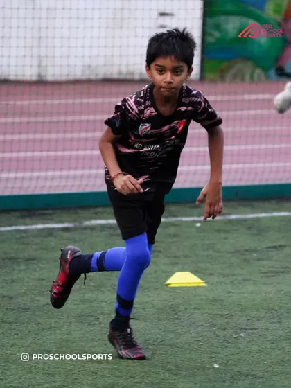 A player works on their running form and agility during a training exercise.