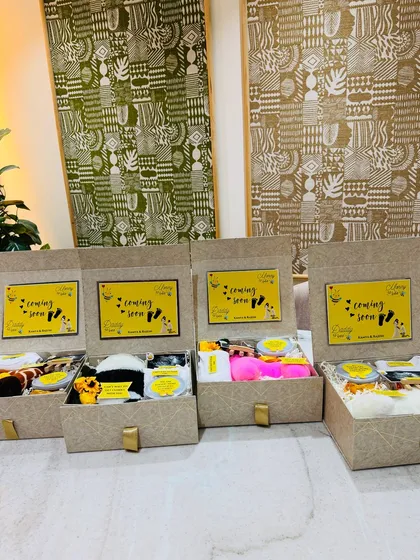 Four beautifully crafted pregnancy announcement boxes, each one a unique and personal way to share the exciting news with loved ones.