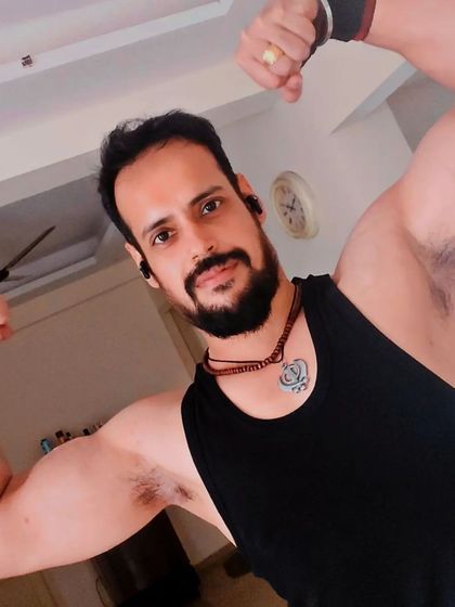 Flexing at home to check in on progress. Fitness isn't just confined to the gym; it's a 24/7 lifestyle of good habits.