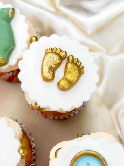 These tiny golden baby feet are one of our most requested designs for baby shower cupcakes. They are a sweet and symbolic addition to your dessert table.