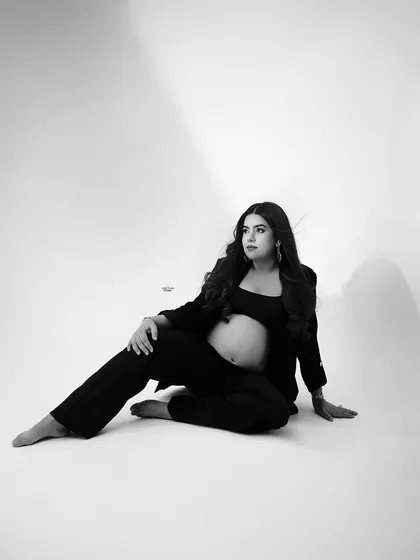 A relaxed and confident pose on the floor. The use of shadow and light in this black and white image is just beautiful.