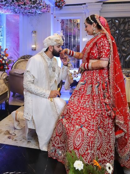 A romantic moment between the couple. The makeup is designed to look soft and beautiful, enhancing the romance of the shot.