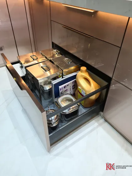 Heavy-duty drawers are essential for storing large pots, pans, and containers of flour or rice. This deep drawer from our Kalpataru Heights project showcases our focus on practical, heavy-duty storage.