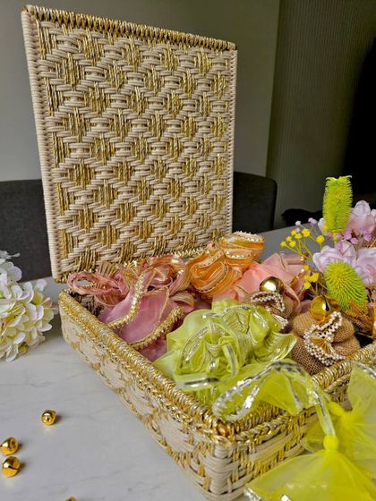 A look inside the handcrafted Sirohi box, filled with beautifully wrapped festive potlis. It's the perfect way to present your Diwali gifts in a sustainable and luxurious way.